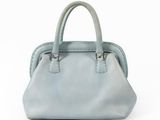 blue leather handbag on a white background