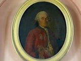 un tableau représentant un homme en manteau rouge accroché au mur