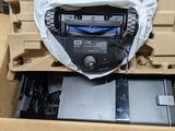 a car radio in a box with a laptop in it