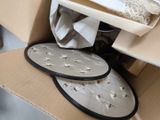 a box that has two plates in it on the floor