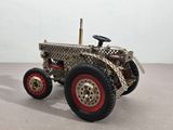 a model of a tractor made out of metal