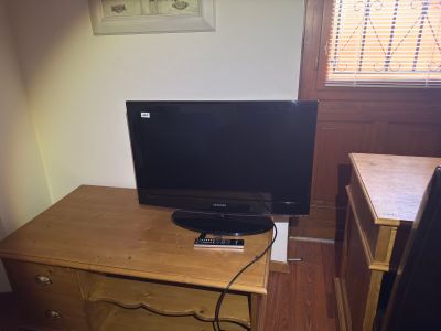 a desk with a computer and a monitor on it
