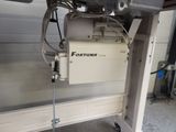 a machine that is sitting on a cart in the garage