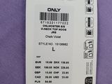 a close up of a label on a purple shirt that says only