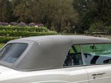 an image of a white car parked in a parking lot