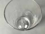 a glass with a small amount of water in it