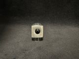 an image of a small square object on a black surface