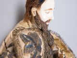 a figurine of a man with a beard and a beard
