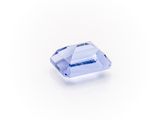 a blue sapphire stone on a white background