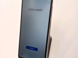 the back of a phone with the dobroo dash button on it