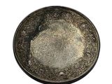 an old silver plate on a white background with a white background