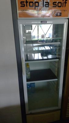 a refrigerator that has a sign on the front of it