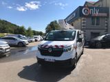 a white van that is parked in front of a building