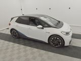 an image of a small white car parked in a garage