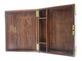 a wooden cabinet with a door open on a white background