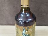 a bottle of wine that is sitting on a table