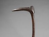 a bronze sculpture of a bird ' s head on a metal stand