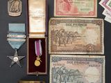 many different medals and medals on display on a table