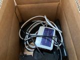 a cardboard box with a cell phone inside of it