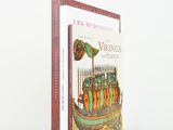 an image of a book with a picture of a boat with people on it