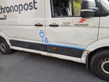 a white van that is parked on the side of the road