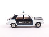 a toy police car that is sitting on a white surface