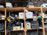 many boxes and other items on the shelves in the room