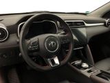 the interior of a car with a steering wheel and dashboard controls