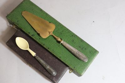 a knife, fork and spoon sitting on a green box