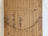 a picture of a wooden board with writing on it
