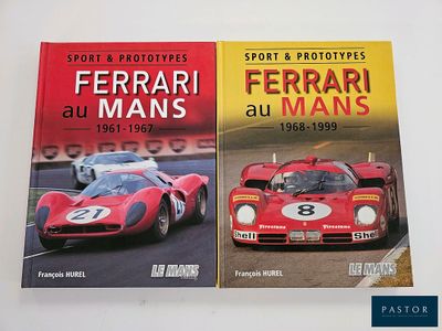 two books about ferraris and ferraris on a white table