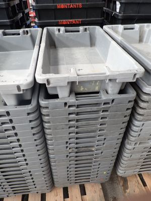 several plastic containers stacked on top of each other on a pallet