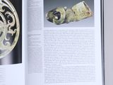an open book with a picture of a decorative object on it