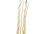 a gold necklace with three strands of pearls on a white background