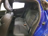 a blue car that is sitting in the back of the car