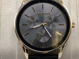 a close up of a wrist watch on a display case