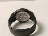 a watch that is sitting on a white surface