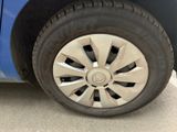a close up of a tire on a blue car