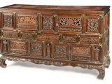 a large wooden chest with many drawers on it