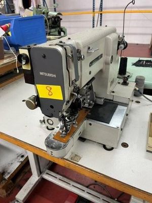 a sewing machine that is sitting on a table