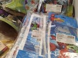 many bags of food and other items on the counter