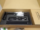 a box with a pen and a charger inside of it