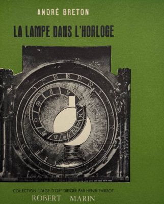 a green book with a picture of a clock on it