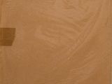 an open cardboard box sitting on top of a table next to a window