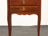 an image of a small wooden table with three drawers on it