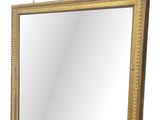 an image of a gold framed mirror sitting on top of a table