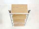 a wooden table with a metal frame on top of it