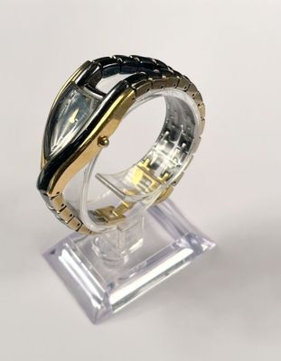 an image of a close up of a wrist watch on a stand