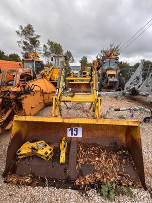 a lot of construction equipment that are sitting in the dirt