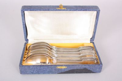 four spoons in a blue box with a gold handle